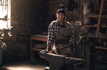 Image showing Foundry, blacksmith and portrait of woman with tools for industry, manufacturing and manual labor. Industrial factory, welding and female person for steel, iron and metal production for craftsmanship