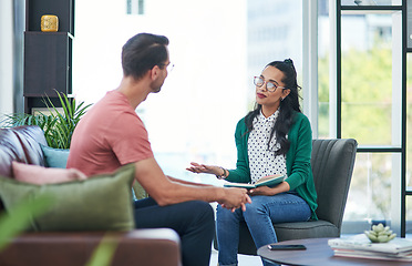 Image showing Mental health, therapy or counseling with a woman psychologist and male patient talking in her office. Psychology, wellness and trust with a female doctor or shrink consulting a man for healing