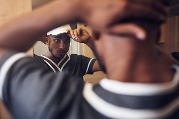 Image showing Baseball player, cap and face of sports man in a locker room getting ready and dressing in mirror. Behind an African athlete person with reflection and hat for sport competition, training or exercise