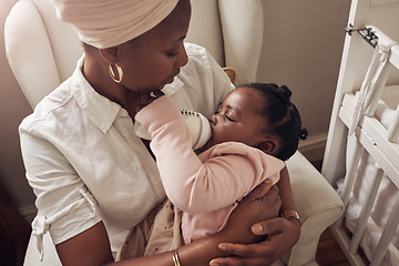 Image showing Love, milk and bottle with mother and baby for care, nursing and morning. Smile, happiness and food with black woman and feeding newborn infant in family home for nutrition, wellness and growth