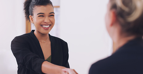 Image showing Handshake, women and happy for welcome, agreement or deal for hiring at corporate law firm. African woman, lawyer and shaking hands for recruitment, teamwork or congratulations with smile at office