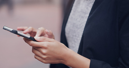 Image showing Hands, phone and business woman in city for closeup texting, networking or email communication on internet. Businesswoman, smartphone and typing in metro street with social media app, chat or contact