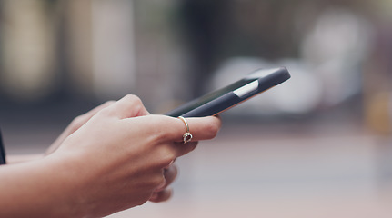 Image showing Woman, hands and searching phone with city background for texting message on social media. Female hand, typing and cellphone for research or writing messages for communication and connection.