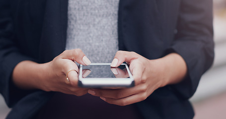 Image showing Hands, phone and business woman in city for closeup texting, networking or email communication on web. Businesswoman, smartphone and typing in metro street with social media app, chat or contact