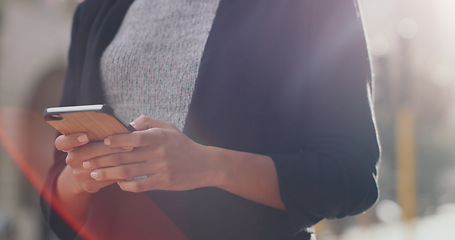 Image showing Hands, smartphone and business woman with closeup in city, texting and networking for email communication. Businesswoman, cell phone and typing in metro street with social media app, chat or contact