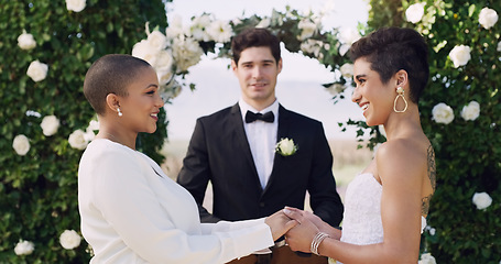 Image showing Love, holding hands and smile with lesbian couple at wedding for celebration, gay and pride. Lgbtq, spring and happiness with women at marriage event for partner commitment, care and freedom