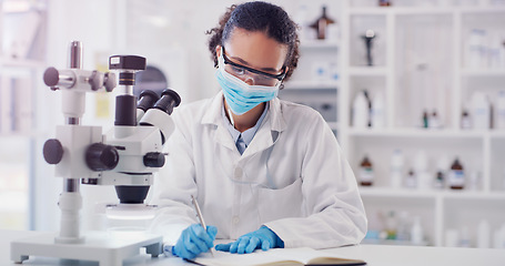 Image showing Scientist, woman writing and lab worker with medical research and face mask in a clinic. Data work, planning and working of a young female employee with a notebook and microscope results for science