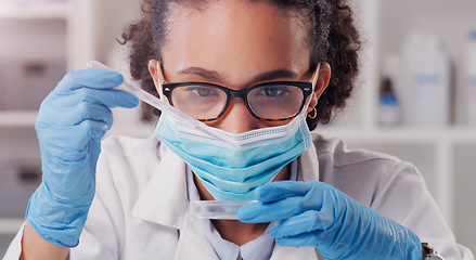 Image showing Woman scientist, dropper and face mask with focus on futuristic research and virus data. Science, African female person and young employee working in a laboratory with chemistry test analysis