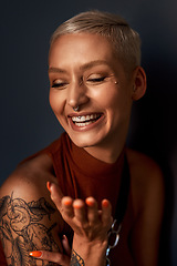 Image showing Young woman, happy laugh and tattoo with hipster and gen z fashion with a smile and piercing. Cool style, face and cosmetics of a female person with happiness, confidence and jewelry wearing makeup