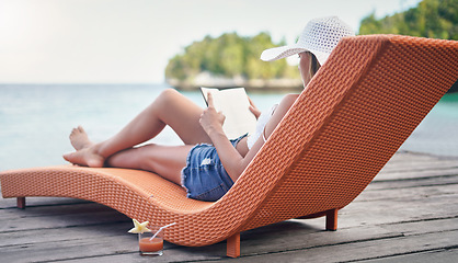 Image showing Relax, reading and travel with woman at hotel resort for summer vacation, peace and tropical. Books, luxury and holiday with female tourist on deck at Bali villa for calm, exotic and resting