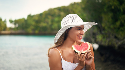 Image showing Woman, watermelon and holiday outdoor with a smile by the sea on a summer vacation. Happiness, female person and relax with fruit and healthy food in nature by the ocean with freedom and travel