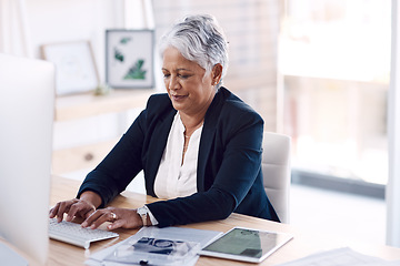 Image showing Busy, computer and management with a business woman or CEO working in her corporate office. Mission, professional and leadership with a senior female manager at work typing an email or proposal