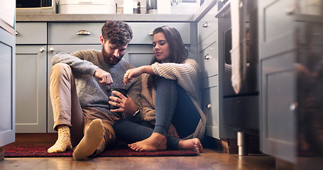 Image showing Ice cream, love and couple on kitchen floor for bonding, relax and quality time together at home. Dating, relationship and happy man and woman with sweet food, dessert and marriage with romance