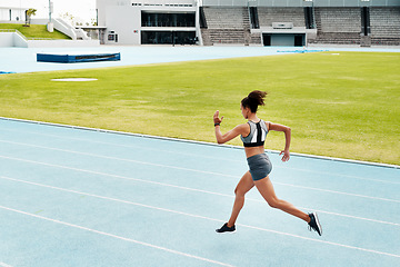 Image showing Woman, fitness and running of athlete on track for exercise, cardio training or workout outdoors. Fit, active or sport female person or runner in sports run, race or athletics for wellness on stadium