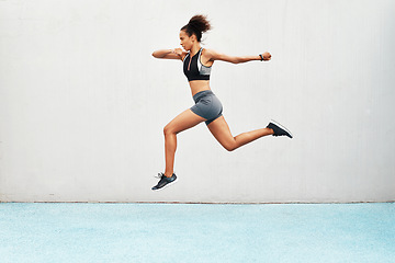 Image showing Woman, fitness and running on mockup in exercise, cardio training or workout outdoors. Fit, active or sport female person or runner in sports motivation, run or healthy wellness on wall mock up space