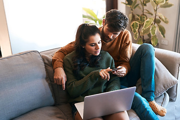 Image showing Laptop, credit card and happy couple on couch, ecommerce or cashback and diversity in home. Smile, man and woman on sofa to relax together, online shopping or payment with bonding time and happiness.