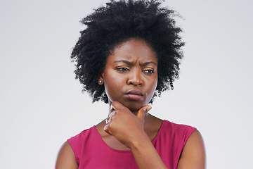 Image showing Doubt, thinking and black woman in studio with frown, decision or choice on grey background space. Confused, suspicious and African female person concerned, questions or planning and solution emoji