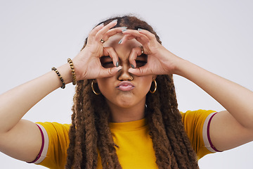 Image showing Portrait, funny face and hand gesture with a black woman in studio on a gray background looking silly or goofy. Comedy, comic or crazy with a quirky young female person joking indoor for fun or humor