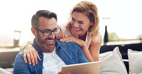 Image showing Couple, happy and tablet for funny movie, streaming or laughing at meme or comedy on sofa. Woman, man and relax together on holiday with technology, watching tv show on stream service on mobile app