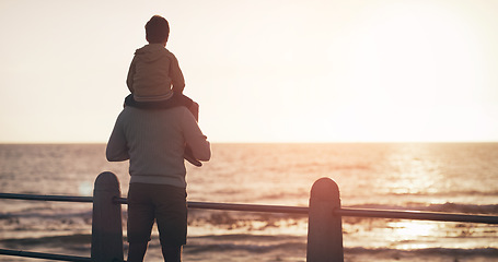 Image showing Father, child and back in sunset at beach for family bonding, playing or fun holiday weekend in nature. Dad carrying kid on piggyback by ocean coast enjoying sunrise or time together on mockup space