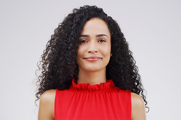 Image showing Portrait, happy and curly with a woman in studio on a white background for beauty or fashion. Face, smile and natural style with an attractive young or real female person confident in trendy clothes