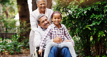 Image showing Grandparents, park and a senior man in a wheelchair together with his wife and adorable granddaughter. Person with a disability, love or time with a happy girl child and her mature family in a garden