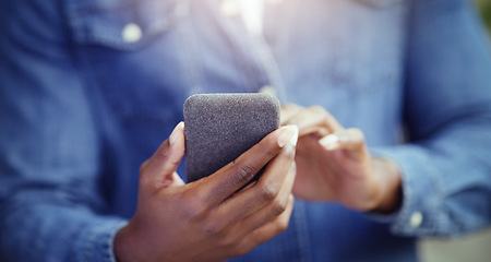 Image showing Hands, phone for social media with communication and technology with internet. Person is online with tech gadget, scroll mobile app with connectivity and chat, browsing and texting closeup