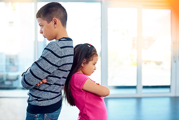 Image showing Anger, brother and sister in home living room, fighting or argument, conflict or problem. Angry, children and kids with arms crossed with their backs together, frustrated and ignore at home