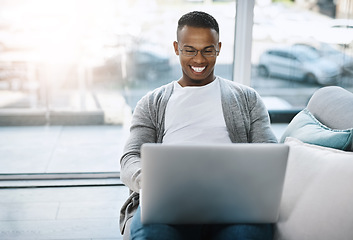 Image showing Laptop, man and working on home sofa or remote learning, elearning or online class, internet and email communication. African male, happy on computer and study, research and work in living room