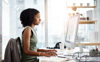 Image showing Computer, typing and business woman in office for online research, copywriting and editing for job website. Young african person, editor or journalist on desktop pc or monitor for article or report