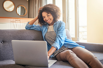 Image showing Technology, black woman with laptop and on sofa of her living room at her home smiling. Social media or connectivity, networking and African female reading an email on her digital device on couch