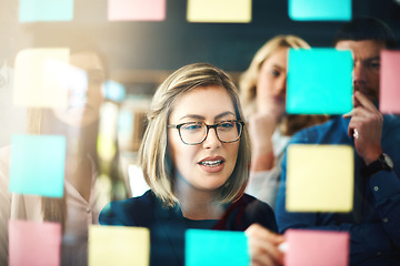 Image showing Woman, ideas and brainstorming with team on glass for schedule, mindmap and planning goals, agenda and timeline. Face of manager, collaboration and sticky note for innovation, training and target