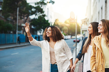 Image showing Friends, women stop taxi in street with travel in city and together outdoor, freedom and happiness. Young female people in cityscape, urban adventure and wait for cab, smile while on friendship date