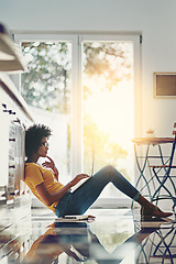 Image showing Relax, laptop and search with black woman on floor for focus, remote work and study. Technology, website and networking with female freelancer thinking at home for blog, email and social media