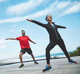 Image showing Fitness, health and couple doing outdoor pilates stretching together for body balance exercise. Happy, smile and young man and woman doing a yoga warm up workout or challenge for health in nature.