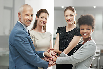 Image showing Happy business people, team and portrait with hands together in agreement or trust at the office. Group piling hand for teamwork, motivation or support in solidarity for company goals at workplace