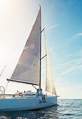 Image showing Ocean, travel and boat in the outdoor with couple for adventure on luxury sea journey. Together, water and transport on yacht with rich lifestyle on a cruise in summer for a holiday with waves.