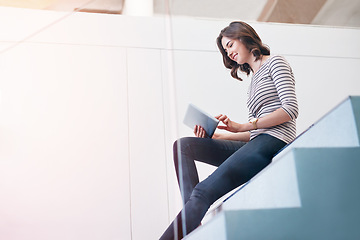 Image showing Digital tablet, staircase and businesswoman in office doing research and planning corporate project. Happy, smile and professional female employee working on company report with mobile in workplace