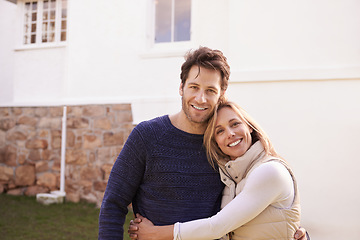 Image showing New home, outdoor portrait and happy couple hug for house, real estate and property purchase, sale or investment. Mortgage, happiness and smiling woman, man or homeowner people embrace for relocation