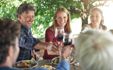 Image showing Family, group and wine glass for toast at table for celebration, food and friends at lunch event. Men, women and smile together to celebrate with alcohol, glasses and support at party, dinner or home