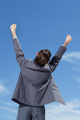 Image showing Celebrate, business man and fist in air with happiness and success feeling excited from promotion. Outdoor, businessman and corporate worker with celebration from target achievement and goals