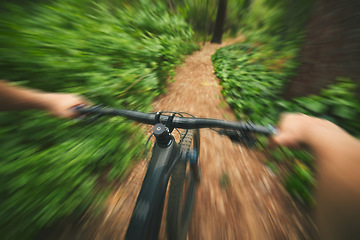 Image showing POV, mountain bike and sports person in forest, park and path for adventure, speed and motion blur. Closeup perspective of bicycle handle, fast athlete and cycling action in nature for off road race