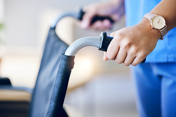 Image showing Woman, hands and closeup of wheelchair handles in nursing home for rehabilitation, help and care. Nurse, helping hand and support for person with disability in hospital, clinic or home for healthcare