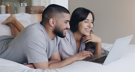 Image showing Happy, couple and relax with laptop in bedroom for watching subscription movies, download media and online shopping. Man, woman and computer tech for streaming, internet or happiness together at home