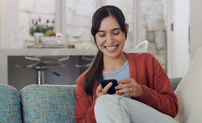 Image showing Happy, woman and typing on smartphone in living room, reading social media post and funny online meme. Female person, smile and relax with cellphone, download mobile games and web connection at home