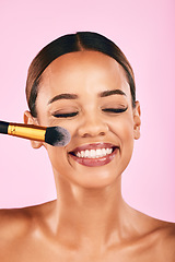 Image showing Happy woman, face and makeup brush for beauty cosmetics against a pink studio background. Female person, smile and brushing with cosmetic tool or equipment for grooming, applying or facial treatment