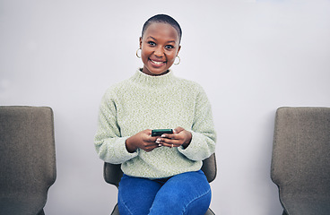 Image showing Black woman, phone and portrait on a chair in a waiting room with network connection for social media. African person happy for recruitment interview with a smartphone for internet, website or app