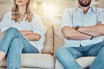 Image showing Couple, arms crossed and argument on sofa, home and breakup in divorce, anger and problems. Closeup of angry man, woman and ignoring partner in fight, conflict and frustrated for relationship crisis