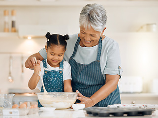 Image showing Bake, grandmother and girl with ingredients, learning and development with utensils, food or love. Family, granny or female grandchild in a kitchen, dough or teaching skills with happiness or bonding