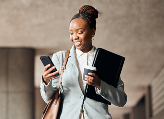 Image showing Phone, coffee and businesswoman walking in the city with a document folder for the office. Cellphone, success and professional African female employee with a latte commuting to work in an urban town.